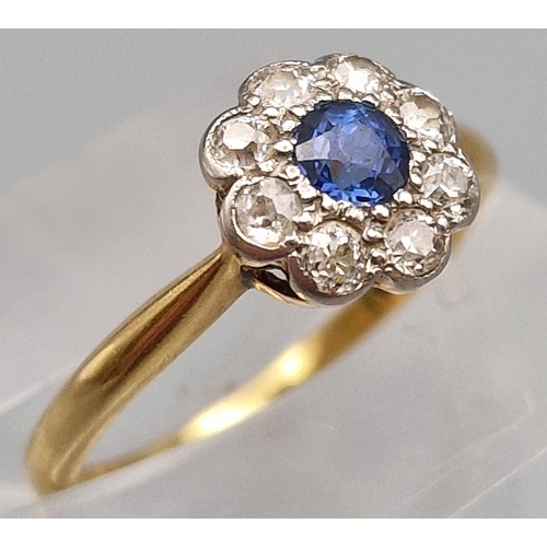246 - 18ct gold diamond and sapphire daisy cluster ring. 1.9g approx. Size M. (B.P. 21% + VAT)