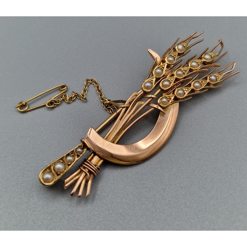 281 - Victorian yellow metal brooch in the form of a sheaf of wheat set with various seed pearls. Registra...