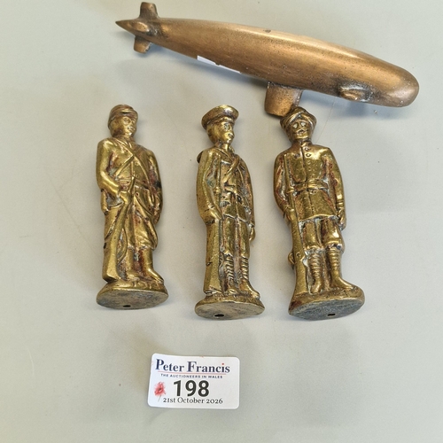 Trench art, comprising three WW1 brass soldier figures, each dated 1914 ...
