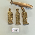 Trench art, comprising three WW1 brass soldier figures, each dated 1914 ...