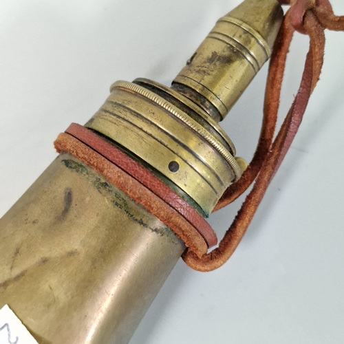 Two brass shot flasks, a powder measure, brass scales, an aluminium oil ...