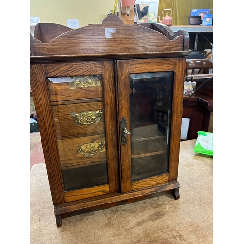 14 - EDWARDIAN OAK TOBACCO CABINET WITH KEY