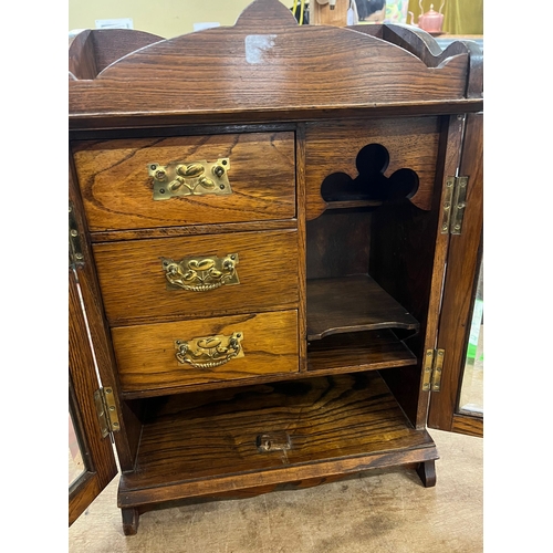 14 - EDWARDIAN OAK TOBACCO CABINET WITH KEY