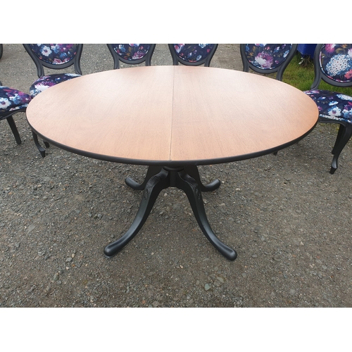 128 - A beautiful floral dining table and 6 chairs painted in a dark pasadena metallic.

The chairs have b... 