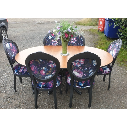 128 - A beautiful floral dining table and 6 chairs painted in a dark pasadena metallic.

The chairs have b... 