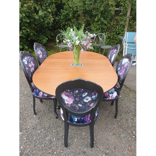 128 - A beautiful floral dining table and 6 chairs painted in a dark pasadena metallic.

The chairs have b... 