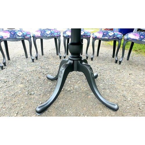 128 - A beautiful floral dining table and 6 chairs painted in a dark pasadena metallic.

The chairs have b... 