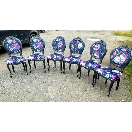 128 - A beautiful floral dining table and 6 chairs painted in a dark pasadena metallic.

The chairs have b... 