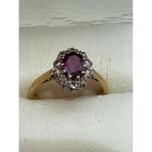 320 - 18CT DIAMOND AND RUBY RING SIZE L