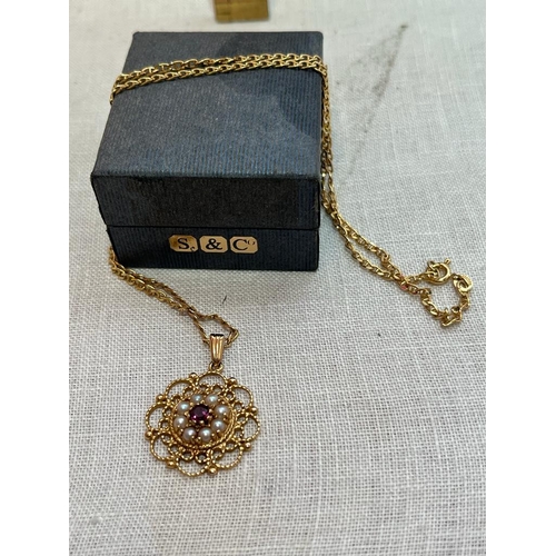 322 - 9CT CHAIN WITH GARNET AND SEED PEARL PENDANT