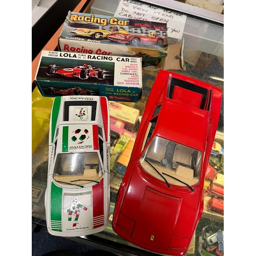 317 - 2 BOXED FRICTION DRIVE CARS AND 2 BBURAGO CARS