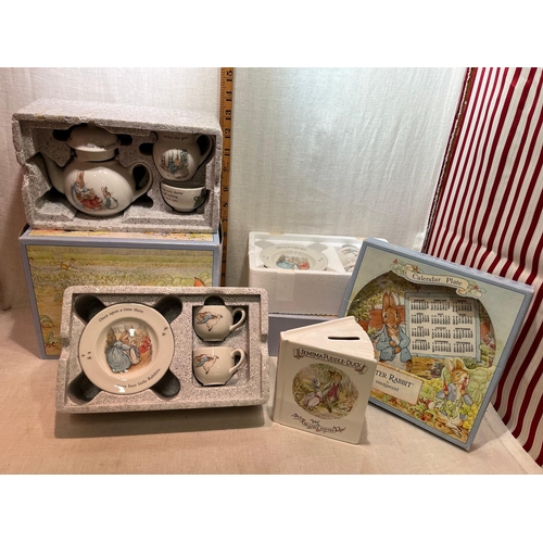 329 - 3 BOXED WEDGWOOD PETER RABBIT SETS AND ROYAL ALBERT MONEY BOX