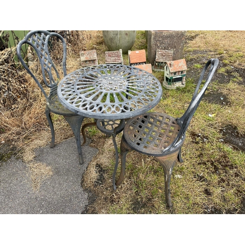 196 - CAST IRON GARDEN TABLE AND 2 CHAIRS