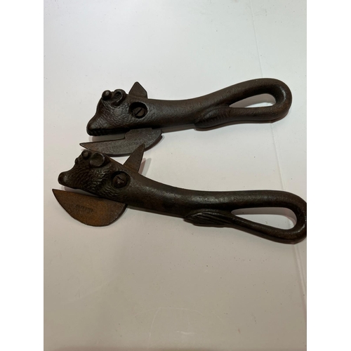 397 - 2 EARLY CAST IRON CAN OPENERS BULLS HEADS