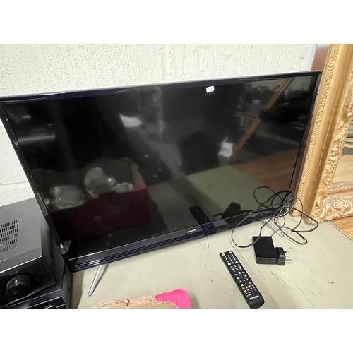 72 - SMALL SAMSUNG TV WITH REMOTE