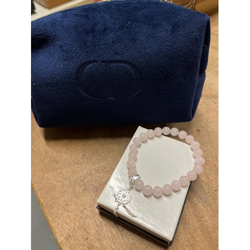 280 - DIOR MAKEUP BAG AND DREAMCATCHER BRACELET