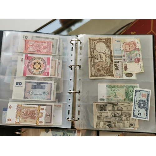 207n - Two Folders of Various Worldwide Currency Banknotes inc Brazil, China, Surinam, France etc