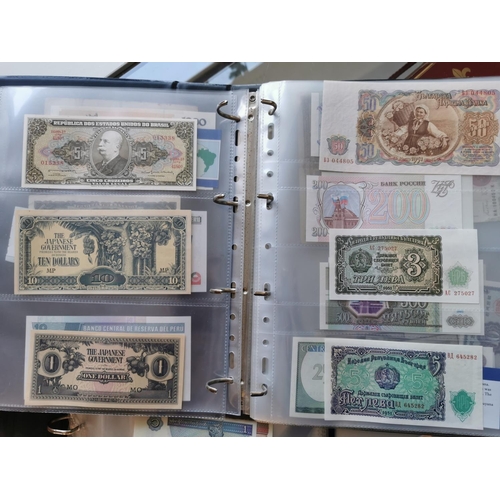 207n - Two Folders of Various Worldwide Currency Banknotes inc Brazil, China, Surinam, France etc