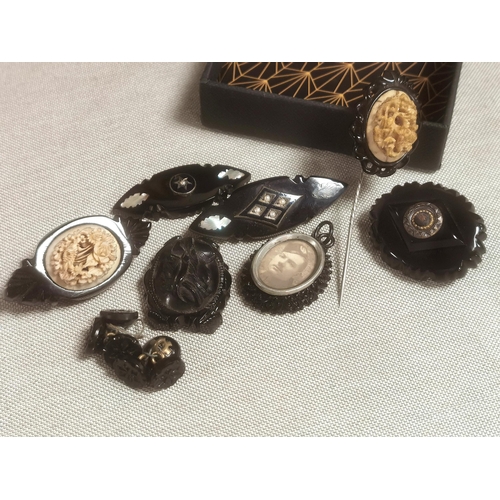 142 - Collection of Whitby Jet Brooches inc Mourning Brooches