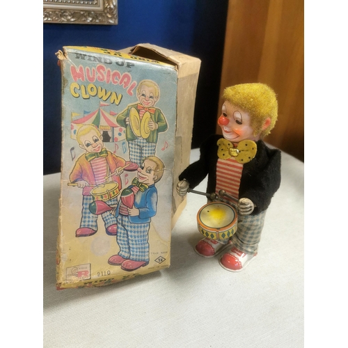 196 - Pair of Early Rosko Tin Wind-Up Bartender and Musical Clown Toys