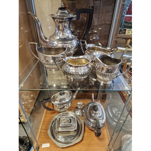 332 - A Pair of Vintage Silver Plated Tea Sets (both shelves)