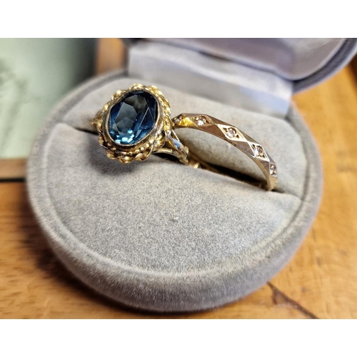 136 - 9ct Gold & Diamond Eternity Ring + a Silver Gilt and Blue Stone Dress Ring - sizes S & M