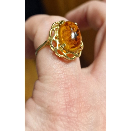 168 - 9ct Gold and Amber Cabochon Dress Ring, size N & 2.3g,