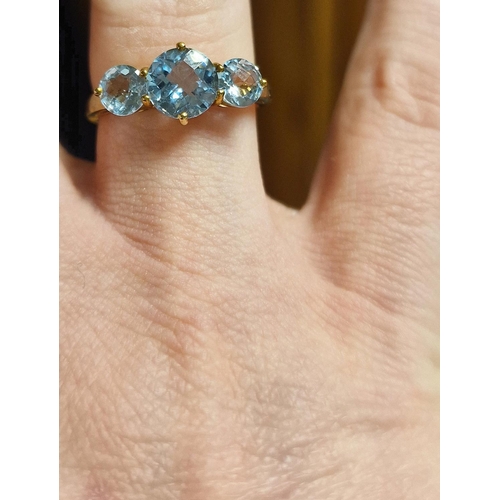 201 - 9ct Gold and Triple Blue Stone, poss Blue Topaz Dress Ring