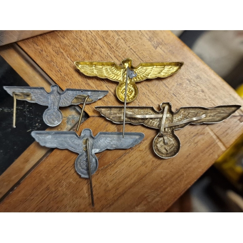 291 - Group of Four German WWII Eagle Cap Pin Badges