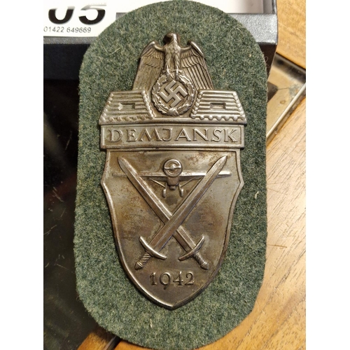 305 - 1942 German Demjansk Campaign Shield Badge with Cloth and Paper Backing