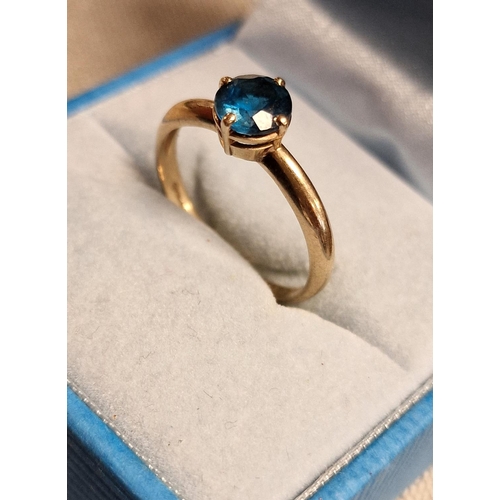 218 - 9ct Gold and Blue Topaz Dress Ring - size O