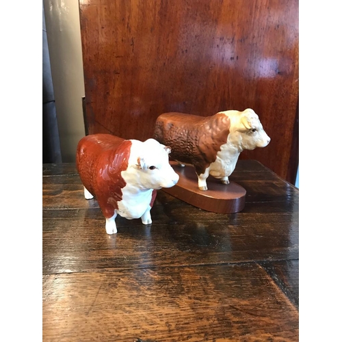 69i - Pair of Beswick Hereford Bull Figures - only slight AF on its ear