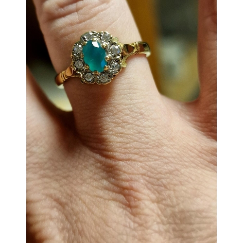 129 - 9ct Gold and Emerald Cluster Dress Ring, 2.8g and size Q+0.5