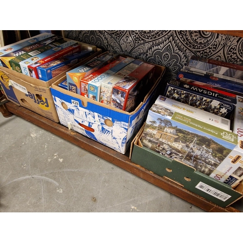 428 - Three Boxes worth of Jigsaw Puzzles