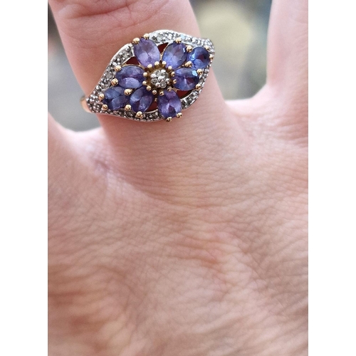 107 - 9ct Gold, Pale Tanzanite & Diamond Floral Cluster Ring, size Q & 3.1g