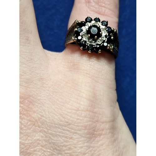 103 - 9ct Gold, Sapphire & Diamond Cluster Ring. Size K and weighs 2.9g