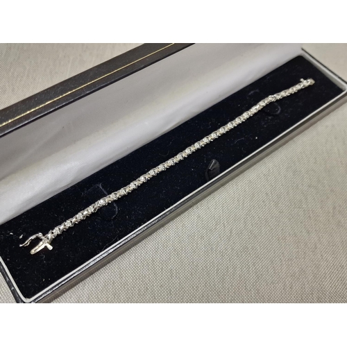 123 - 10ct White Gold & Tennis Bracelet - stamped 0.25ct & XRF tested - 6.3g & 7.5 inches long