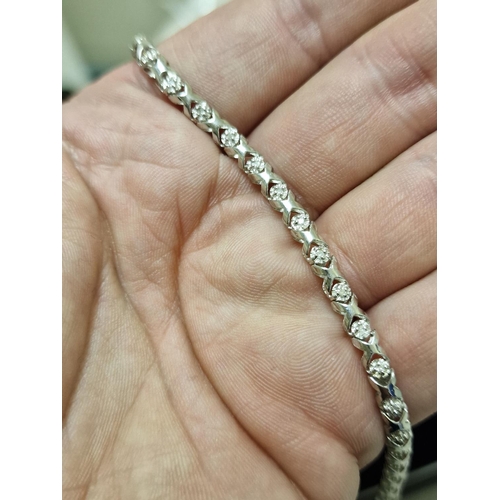 123 - 10ct White Gold & Tennis Bracelet - stamped 0.25ct & XRF tested - 6.3g & 7.5 inches long