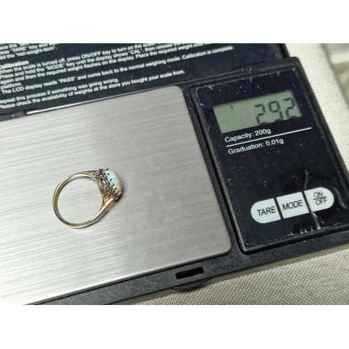 56 - 9ct Gold, Opal & Diamond Dress Ring. Size K and weighs 2.9g approx