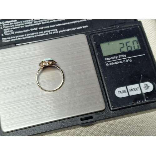 57 - 9ct Gold & Opal Dress Ring,  set with single opal (measures 14x10mm approx). Size R and weighs 2.6g ... 