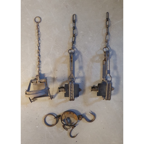 Set of Four Antique Wrought Iron Man Traps and Weights