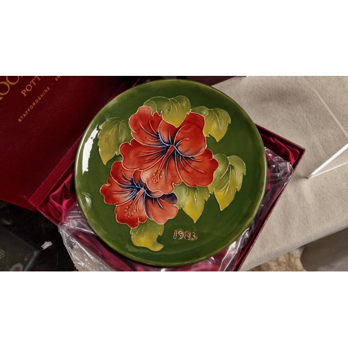 59i - Moorcroft Pair of Boxed Annual 1982 and 1983 Floral Year Plates - 22cm diameter