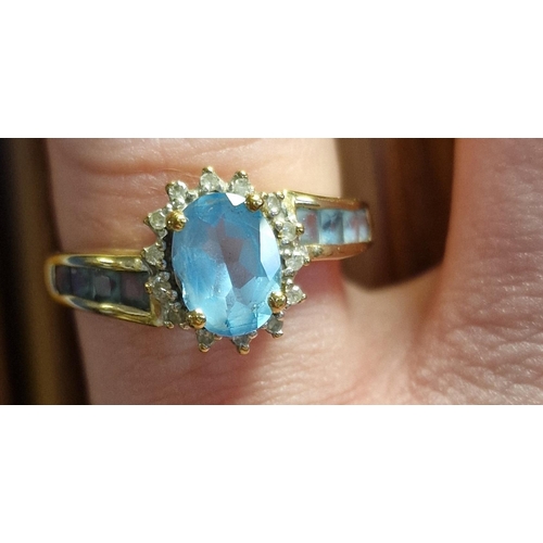 130 - 9ct Gold, Diamond & Blue Topaz Dress Ring, size O & 2.75g