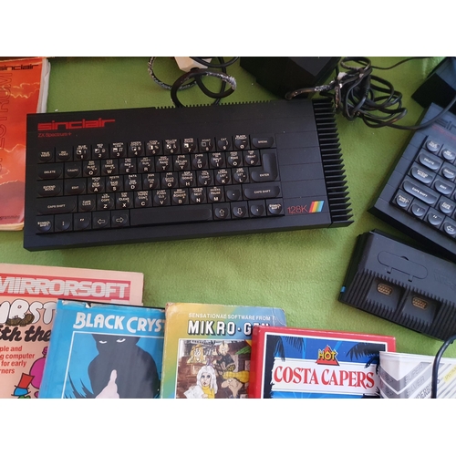 257 - Pair of Vintage ZX Spectrum Computer consoles (incl 128K) , accessories and small quantity of games