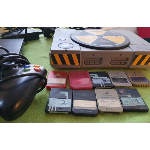 258 - Sony Playstation and Playstation 2 game consoles with accessories, handsets and memory cards