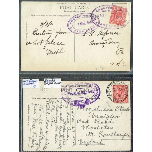 52 - POSTAL HISTORY - Maritime: Jamaica 1910-13 Two postcards POSTED ON THE HIGH SEAS violet ovals with E... 