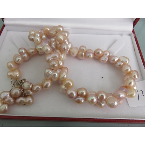 113 - Strand of Pearls with a Silver Clasp