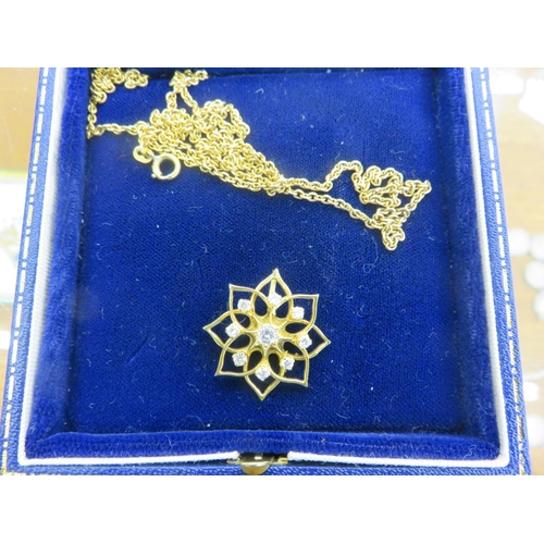 122 - 18ct Gold Floral Diamond Pendant on a Chain