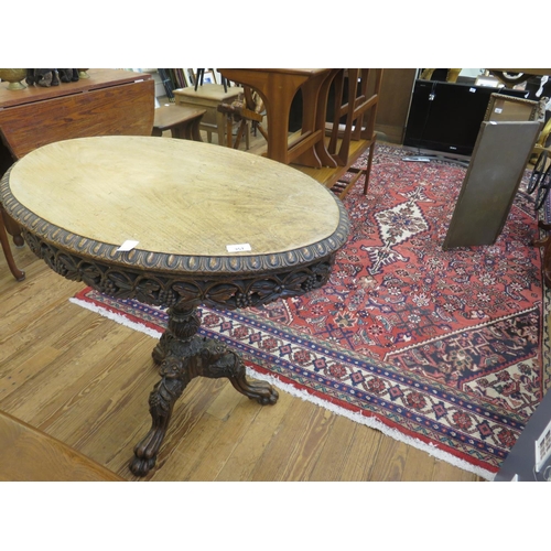 351 - Heavily Carved Oval Oak Table on Ornate Tripod Base