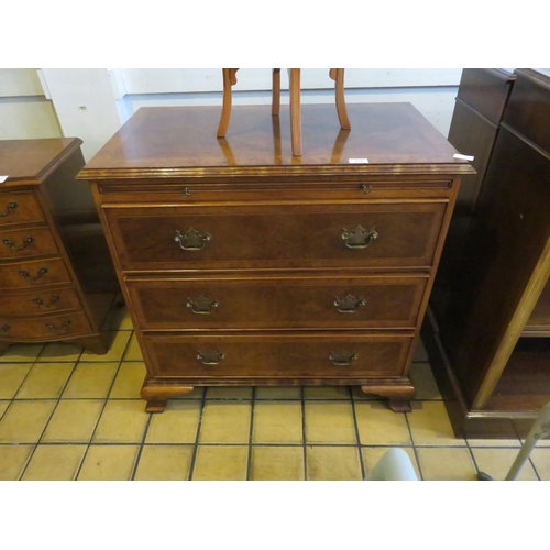 379 - Walnut three drawer chest with brushing slide